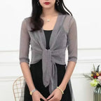 Lätt glittrig kort kofta - Kristi